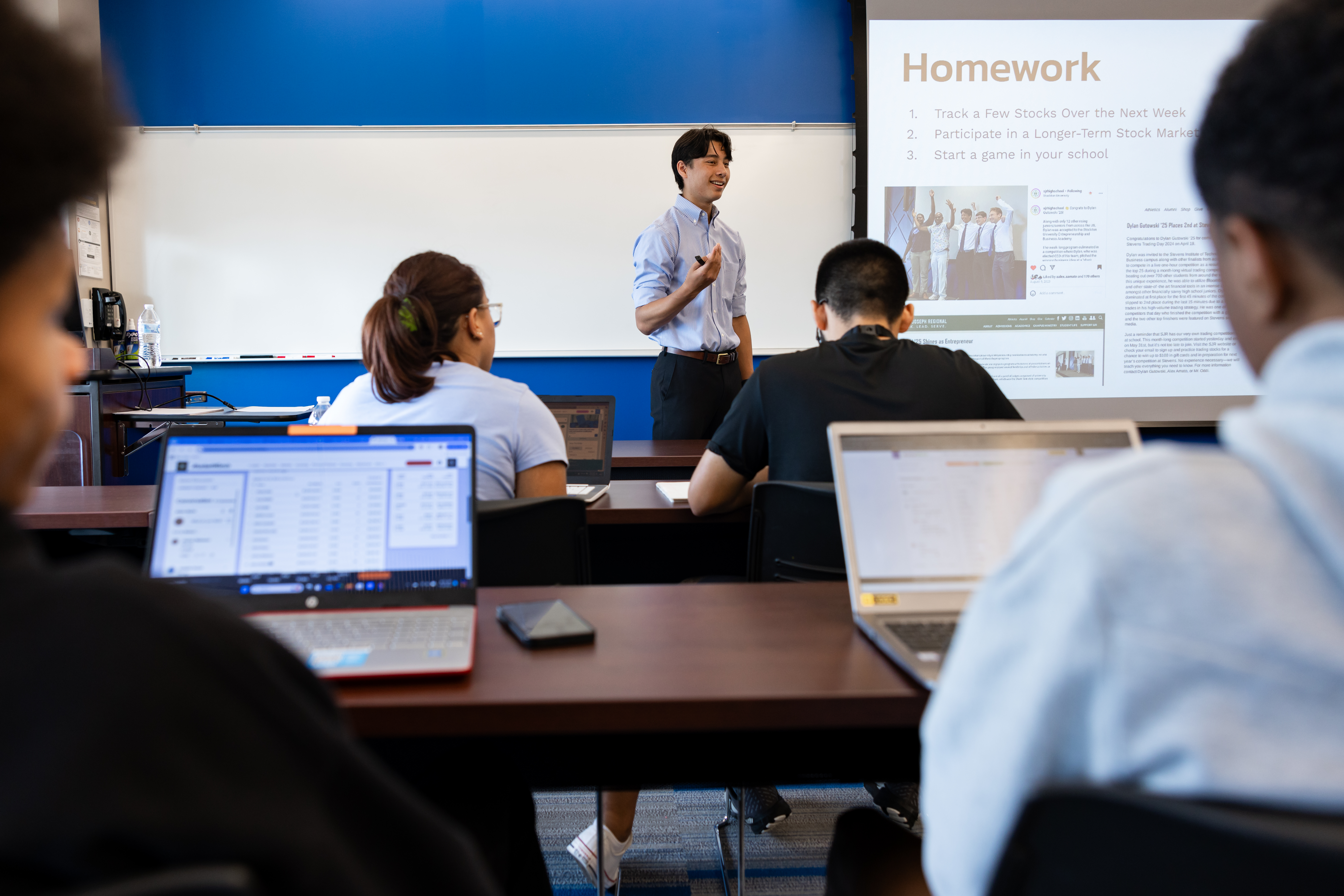 Dylan teaching a Rise and Invest workshop
